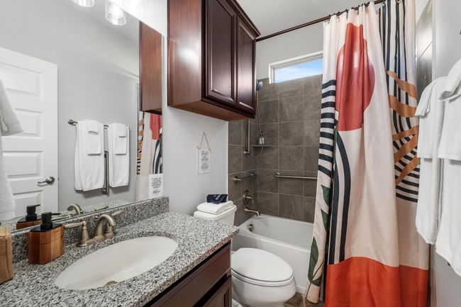 The second bathroom has ADA-compliant grab bars, shower window and new vanity lighting. | Image 28