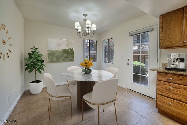 Virtual Staging Dining space featuring a chandelier and light tile patterned flooring | Image 4