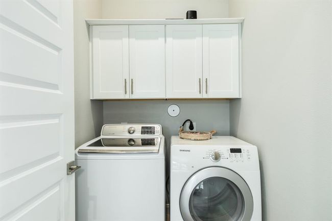 The laundry room features washer and dryer connections, andplenty of storage space. | Image 29