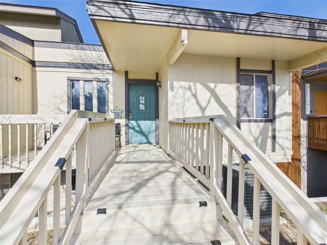 Entry with cute table and chairs out front. | Image 28