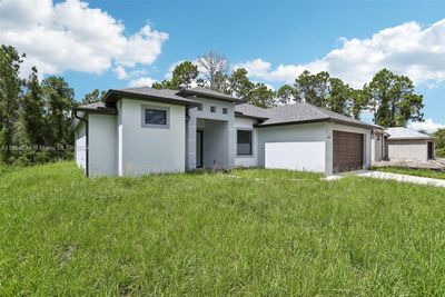 872 Spaulding St E, House other with 3 bedrooms, 3 bathrooms and null parking in Lehigh Acres FL | Image 1