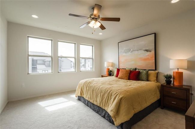 Bedroom featuring light colored carpet, recessed lighting, and ceiling fan | Image 20