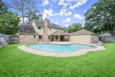 Beautiful back yard with pool/spa and covered patio. | Image 2