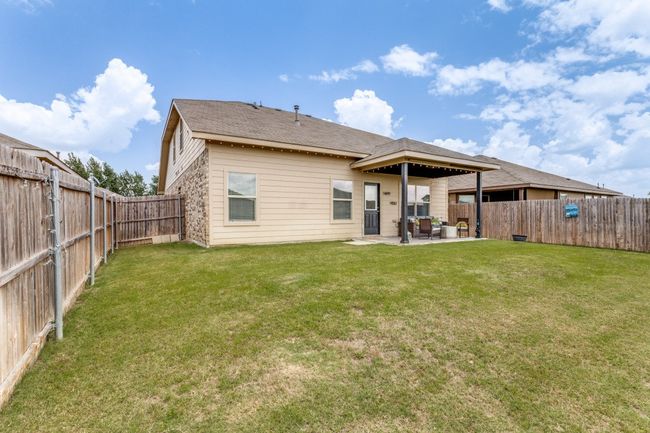 Back of house with a fenced backyard and a patio area | Image 36