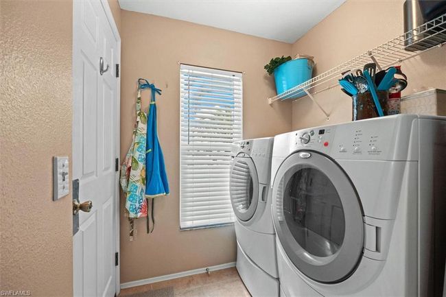 Laundry room with independent washer and dryer, laundry area, and baseboards | Image 27