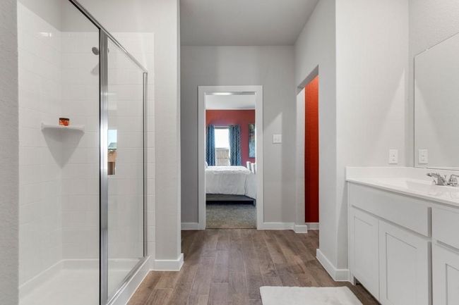 Primary Bathroom featuring an enclosed shower, vanity. Tile flooring in the bathroom not hardwood flooring | Image 6