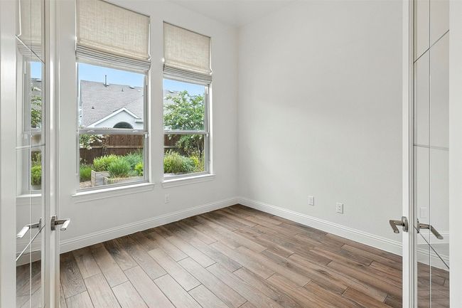 Empty room featuring French doors and tile floors | Image 15