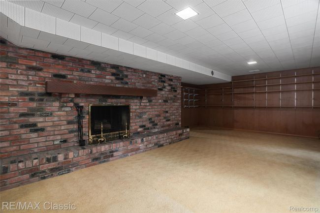 Full wall natural fireplace in basement | Image 27