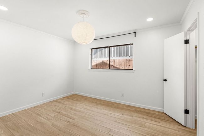 Unfurnished room featuring crown molding, light wood finished floors, and recessed lighting | Image 23