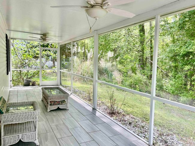 Sunroom / solarium featuring a ceiling fan | Image 5