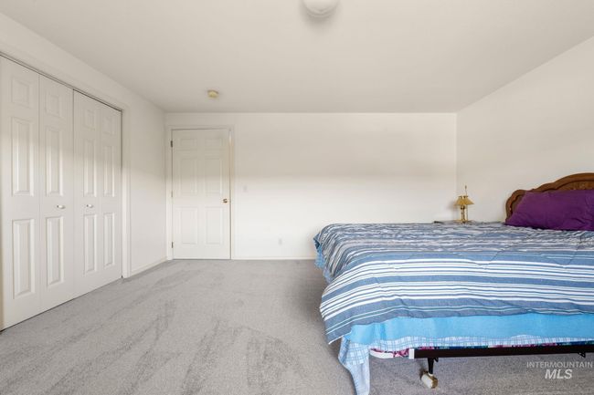 Carpeted bedroom with baseboards | Image 29