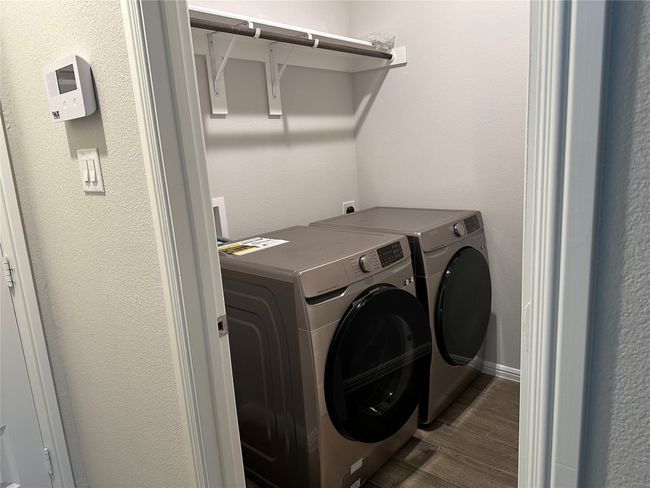 Washroom with independent washer and dryer and dark wood-type flooring | Image 12
