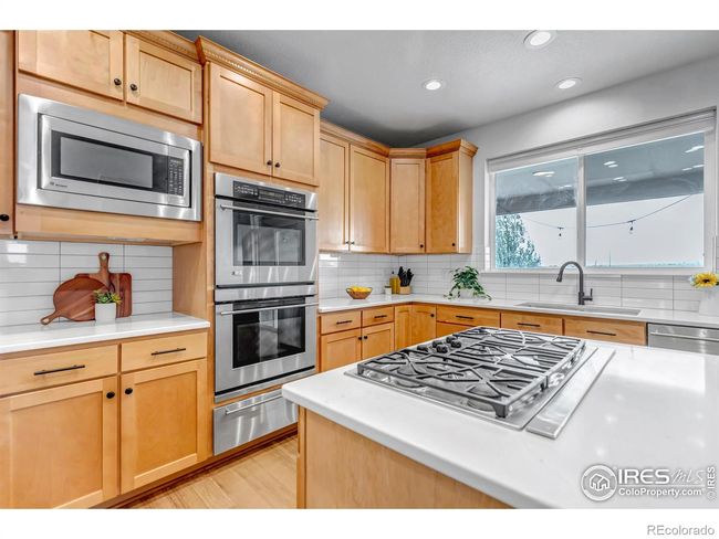 GE Monogram Appliances with 5 burner gas range and pop-up vent, double wall ovens, and warming drawer! Perfect for cooking and entertaining! | Image 13