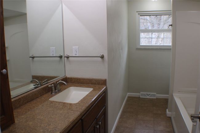 Full bathroom with a large linen closet. | Image 21