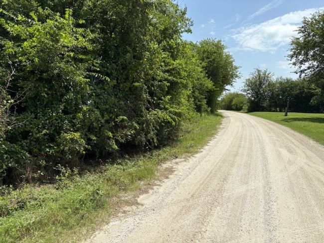 View of dirt / gravel road | Image 12