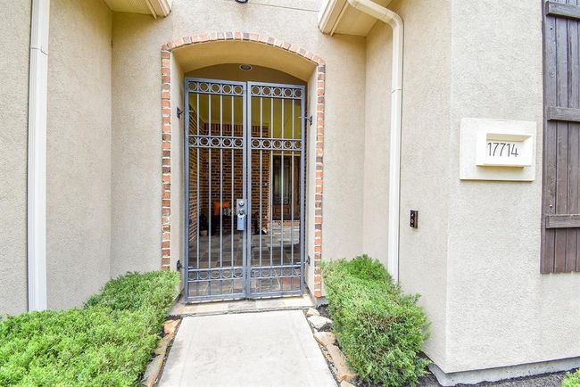 Wrought iron gate leads to the shaded front porch with access to the large side yard that will easily accommodate a swimming pool! | Image 5