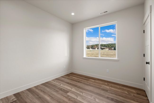 Unfurnished room featuring visible vents, recessed lighting, baseboards, and wood finished floors | Image 20