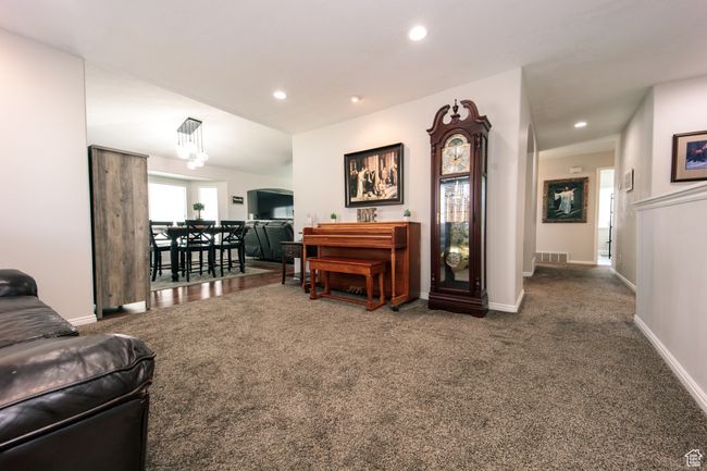 View looking from formal front room to dinning and family room. | Image 5