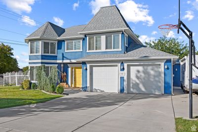 View of front of house with a front yard and a garage | Image 3