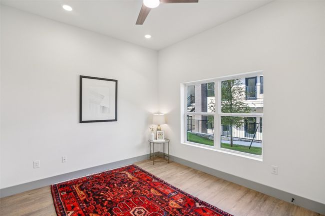 Empty room with recessed lighting, ceiling fan, and wood finished floors | Image 21