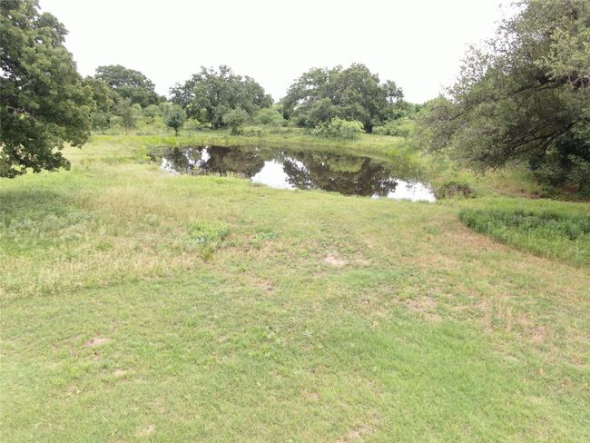View of yard with a water view | Image 25
