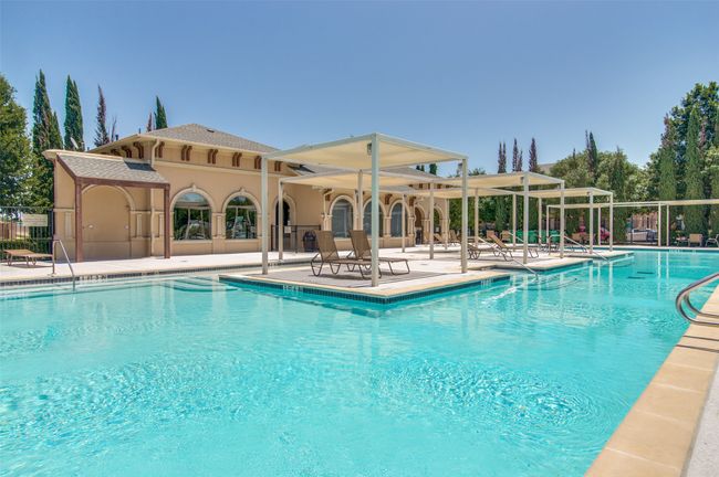 Community pool with a patio | Image 30