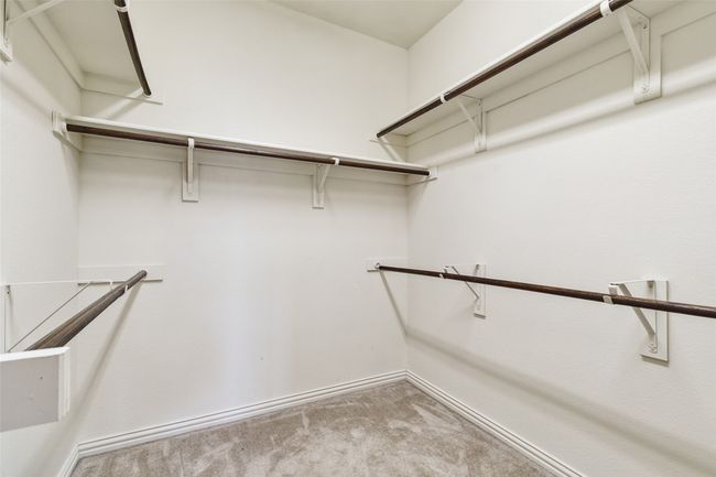 Spacious closet featuring carpet | Image 25