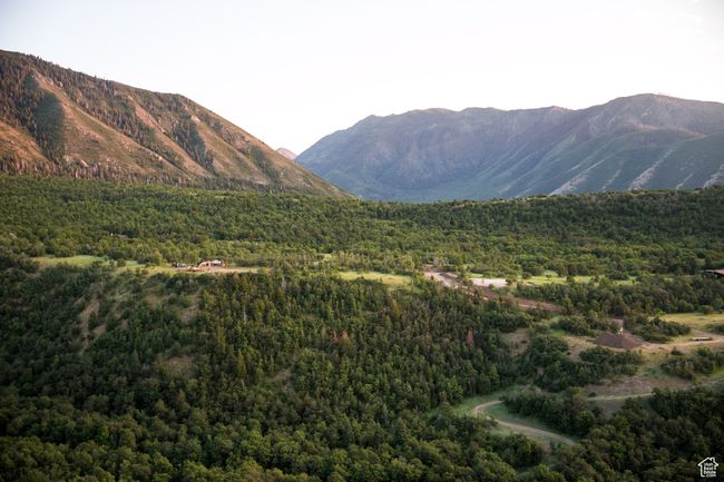 View of mountain backdrop featuring a forest | Image 23