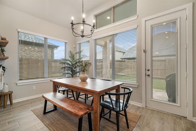 Dining area leads to back door. | Image 13