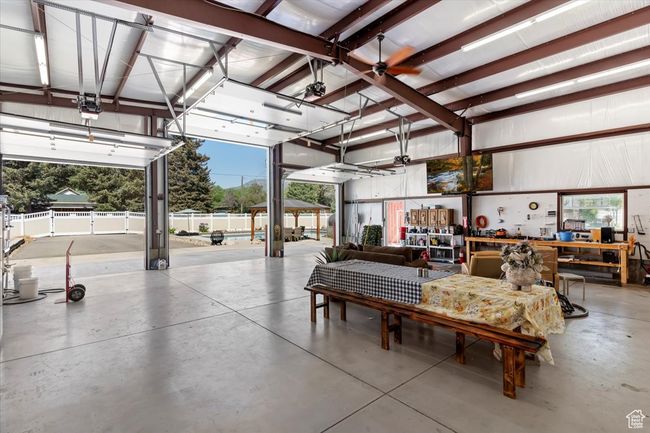Garage with a workshop area | Image 24