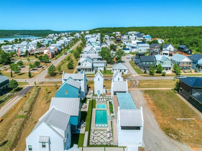 Aerial perspective of suburban area with a pool area | Image 5