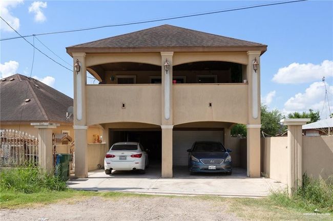 View of front of property with a carport and a balcony | Image 10