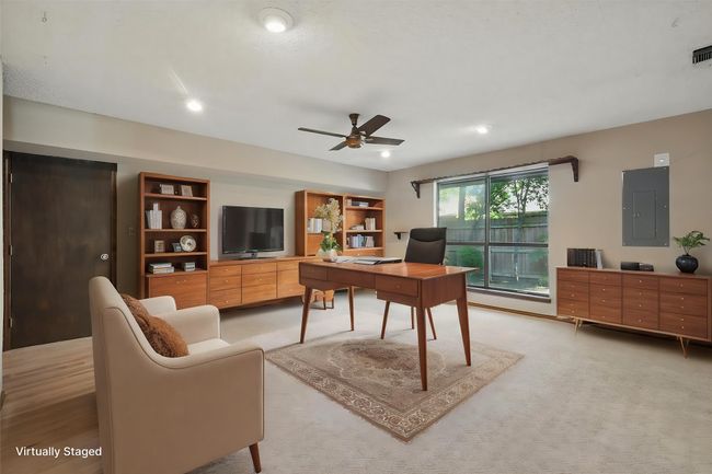 Virtually Staged Office with electric panel, visible vents, recessed lighting, and ceiling fan | Image 11