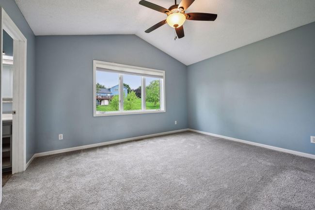 The three car attached garage has a built in workbench | Image 14
