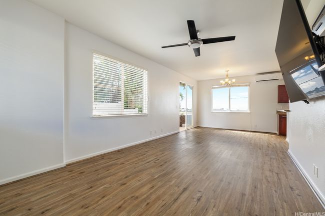 How would you use this space? Viewing the living room from the base of the stairs. | Image 10