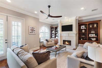 Living room on the second level featuring a fireplace and built-ins on two sides. | Image 3