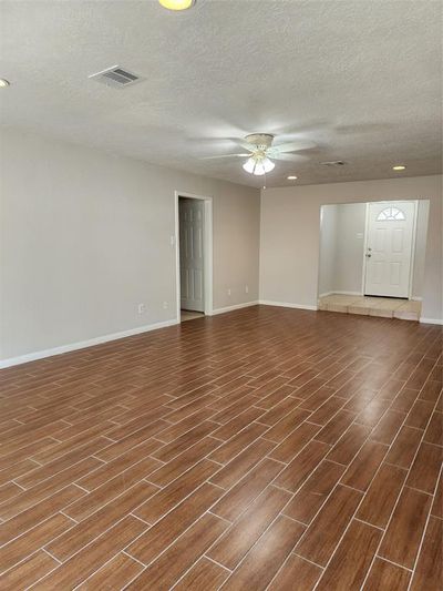 Living room with wood looking tiles | Image 3