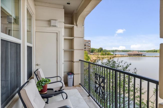 Balcony featuring a water view | Image 25