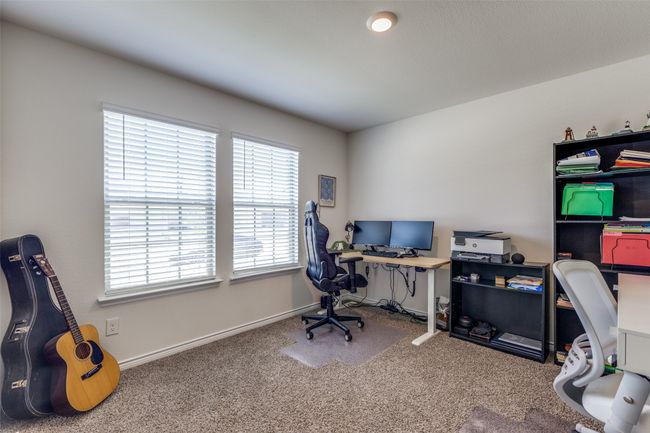 Carpeted home office could also be utilized as a 4th bedroom. | Image 17