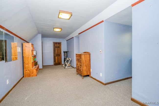 Level 3 has this BONUS! An exercise room-studio-music room-study-office-inhouse heated and cooled storage or whatever your lifestyles needs. There's a walk-in closet and 2 dormer windows. | Image 70