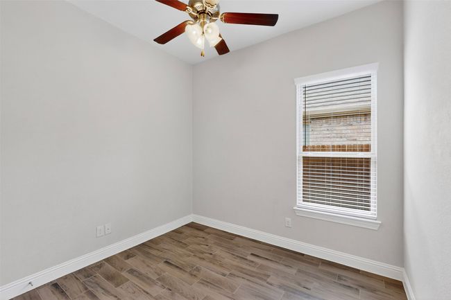 Spare room with wood finished floors and ceiling fan | Image 22