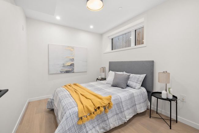 Bedroom featuring wood finished floors, baseboards, and recessed lighting | Image 15
