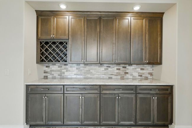 Built in buffet - granite top, upper and lower cabinets, wine rack | Image 11