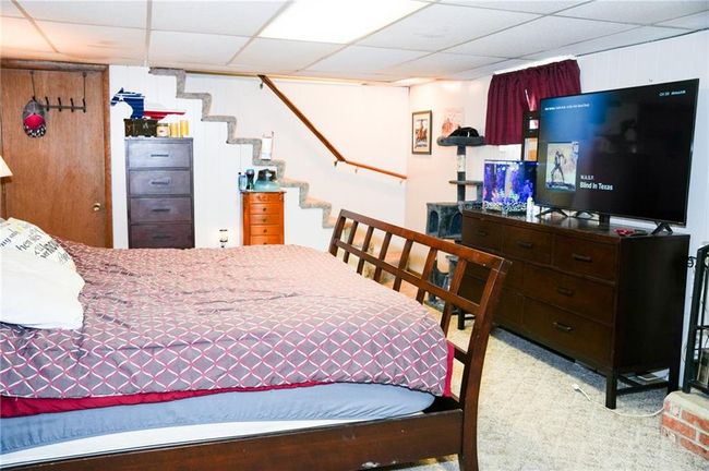 Bedroom featuring a paneled ceiling and carpet floors | Image 17