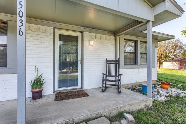 Property entrance featuring a porch and brick siding | Image 32