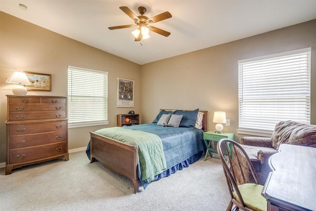 Carpeted bedroom featuring lofted ceiling and a ceiling fan | Image 20