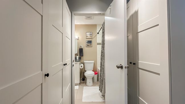 Full bathroom with tile patterned floors and toilet | Image 14
