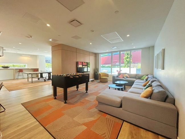 Recreation room with light wood-type flooring and recessed lighting | Image 14