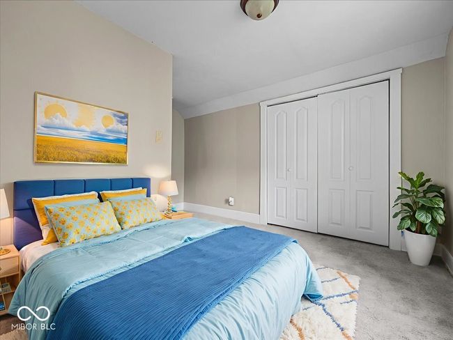 carpeted bedroom featuring a closet and baseboards | Image 19