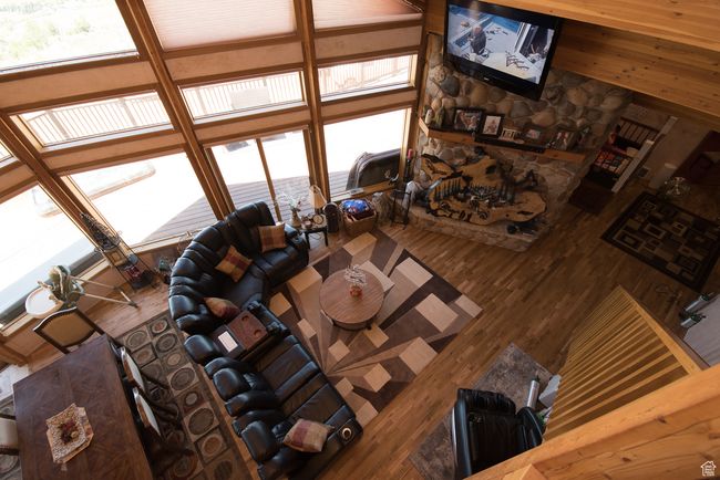 Living area with wood finished floors | Image 79